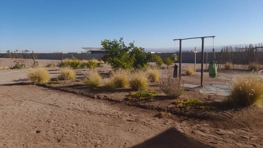 Área de juegos infantiles en el terreno, parcela con casa en Altos de Miraflores, Pica