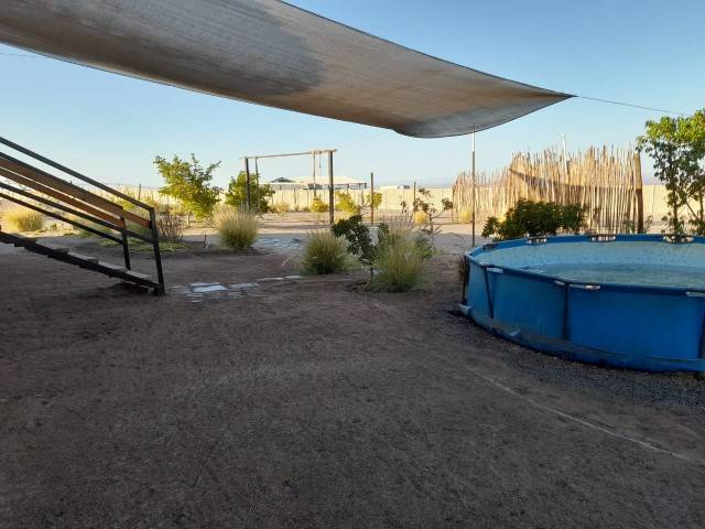 Piscina desmontable circular con malla sombra, parcela con casa en Altos de Miraflores, Pica